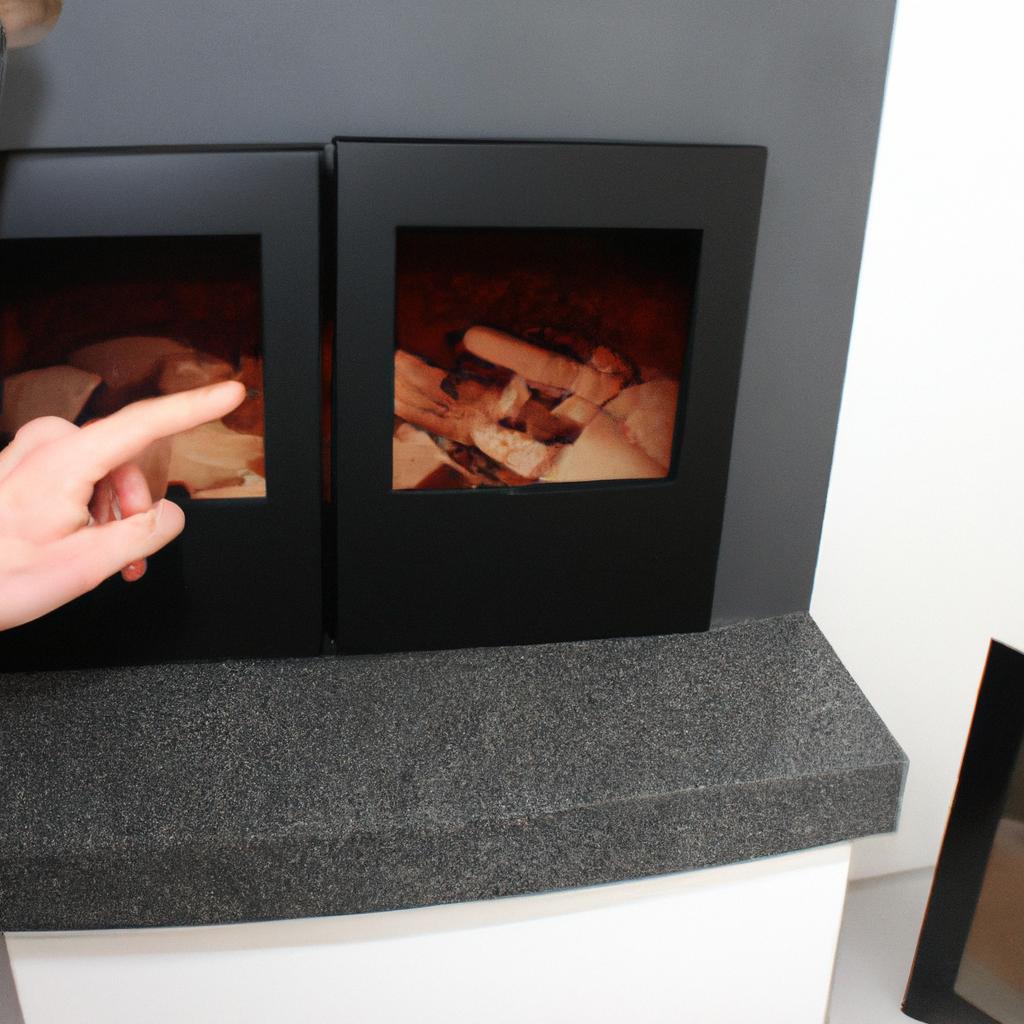 Person inspecting various fireplace designs