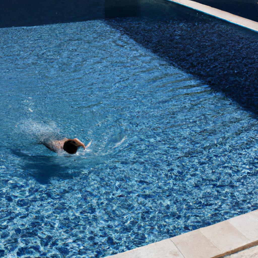Person swimming in luxurious pool